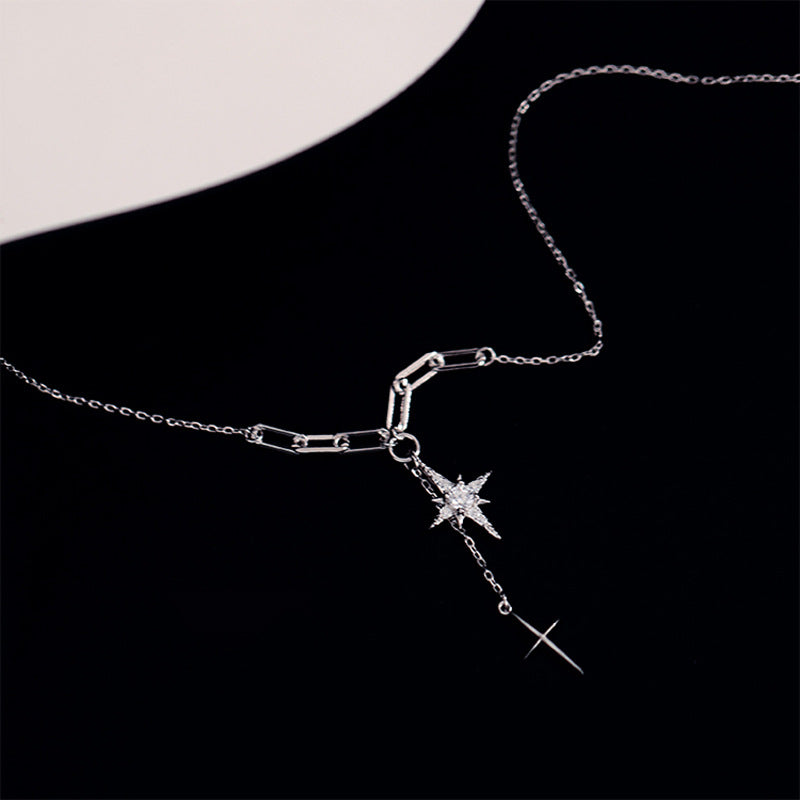 AZURE LEAF The diamond-studded starburst cross pendant.