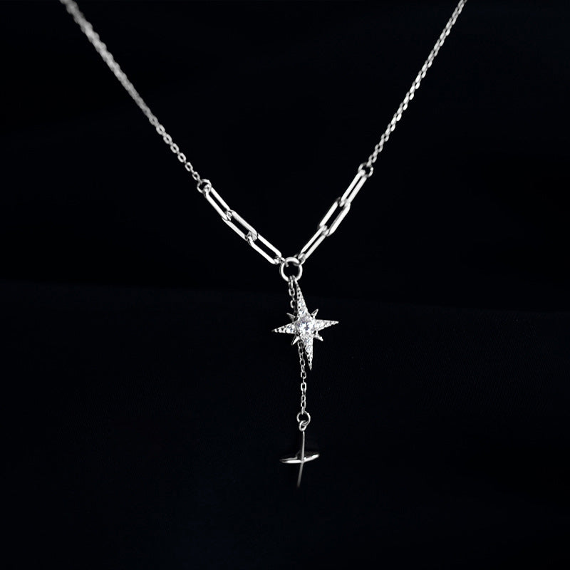 AZURE LEAF The diamond-studded starburst cross pendant.